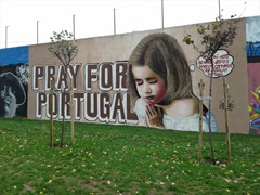 Grafitti an einer Mauer in Lissabon